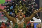 A reveller from Salgueiro samba school performs during the carnival parade at the Sambadrome in Rio de Janeiro, Brazil ...