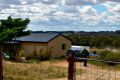 The property in Young, NSW, being searched by the Australian Federal Police on Tuesday.