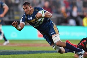 CHRISTCHURCH, NEW ZEALAND - FEBRUARY 25: Rory Arnold of the Brumbies is tackled by Ryan Crotty of the Crusaders during ...