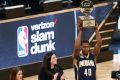 Standing tall: Glenn Robinson III lifts the NBA Slam Dunk trophy.