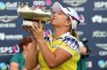 Sweet victory: South Korea's Ha Na Jang kisses the Australian Open cup.