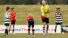 Big kid: Two time Geelong premiership-winning captain Tom Harley throws the ball up