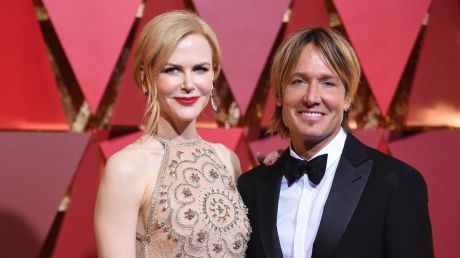 Nicole Kidman, wearing a feature red lip, and Keith Urban arrive at the Oscars on Sunday, Feb. 26, 2017, at the Dolby ...