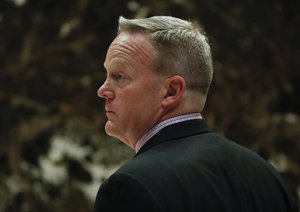 Sean Spicer, Republican National Committee communications director and chief strategist, waits for an elevator as he arrives at Trump Tower, Wednesday, Nov. 16, 2016, in New York.