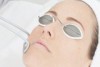 Woman undergoes laser treatment.