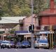 Shopfronts along Warburton Highway face away from the river, but sell everything for a dip in it.