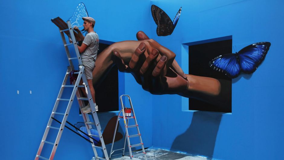 Danila Shmelev, an artist from Moscow, Russia, works on a 3-D picture in Dubai, United Arab Emirates, Monday, Feb. 27, ...