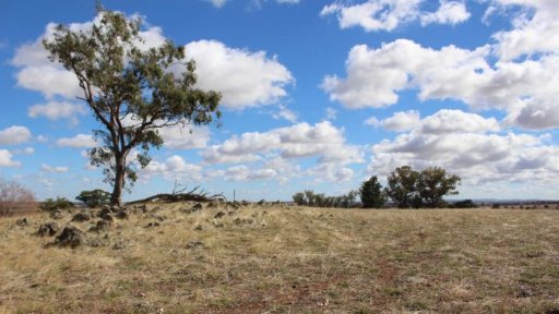 George Brabin explains gold mining exploration on his farm.