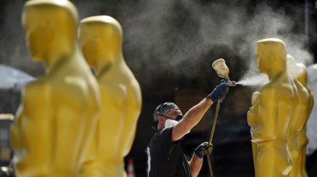 Scenic artist Rick Roberts paints Oscar statues for Sunday's 89th Academy Awards red carpet in Los Angeles.