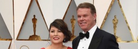 Martha L. Ruiz and Brian Cullinan from PricewaterhouseCoopers arrive at the Oscars.