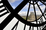 The Louvre as seen from the cafe through the clock at Musee d'Orsay.