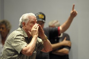 Attendees express their anger as Rep. Daniel Webster, R-Fla., talks about the current fiscal budget during a crowded town hall meeting in Orlando, Fla., Tuesday, April 26, 2011.