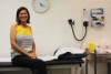 a doctor sitting in her clinic room