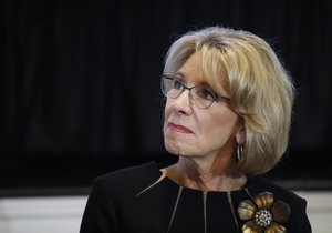 Education Secretary Betsy DeVos, listens to Vice President Mike Pence speak during a listening session with the historically black colleges and universities at the Eisenhower Executive Office Building on the White House complex in Washington, Monday, Feb. 27, 2017.