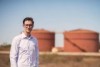 Mark Alchin smiles in a simple portrait shot with his glasses on