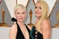 BFFs Michelle Williams, left, and Busy Philipps at the Oscars.