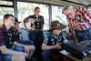 Trainer Tony Falla showing the Castlemaine Venturers how to tune in on the amateur radio equipment  from the inside of a bus.