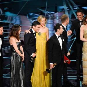 Actors Ryan Gosling and Rosemarie DeWitt, composers Benj Pasek and Justin Hurwitz, and actress Emma Stone look on as 'La La Land' wins Best Picture due to a presentation error (later corrected to 'Moonlight') onstage during the 89th Annual Academy Awards at Hollywood & Highland Center on February 26, 2017 in Hollywood, California. (Photo by Kevin Winter/Getty Images)