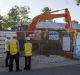 14 Sherlock Street, Kaleen, as workers prepare to demolish on Monday.