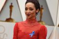 Ruth Negga wears an ACLU ribbon as she arrives at the Oscars.