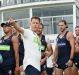 Bolton addresses the players during a preseason training session.