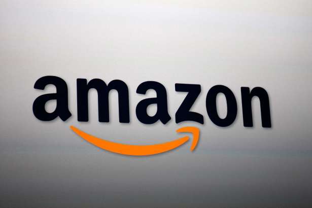 SANTA MONICA, CA - SEPTEMBER 6:  The Amazon logo is projected onto a screen at a press conference on September 6, 2012 in Santa Monica, California.  Amazon unveiled the Kindle Paperwhite and the Kindle Fire HD in 7 and 8.9-inch sizes.
