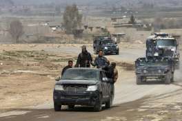 Iraqi forces advance during fighting against Islamic State militants on the western side of Mosul, Iraq, Monday, Feb. 27. 2017. A senior Iraqi police commander said Monday that troops have taken control of the western side of a key bridge in Mosul amid intense clashes with the Islamic State group. The commander of the Federal Police Rapid Response Force, said his forces pushed into Mosul's western Gawsaq neighborhood Monday, reaching the foot of what's known locally as the 4th Bridge.