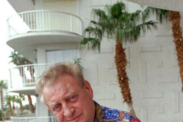 FILE - In this Feb. 10, 1997 file photo, actor and comedian Rodney Dangerfield poses for a photo in Las Vegas. NY1 television says the comedian's widow, Joan Dangerfield, doesn't think a mural in his old New York City Queens neighborhood does him justice. Artist Francesca Robicci painted the mural in 2016 in Queens, working from a photo provided by Dangerfield. Dangerfield also donated $1,000 toward the project, which was commissioned by a community group.