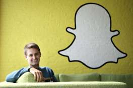 FILE - In this Thursday, Oct. 24, 2013, file photo, Snapchat CEO Evan Spiegel poses for a photo in Los Angeles. As Snap prepares to go public, following in the footsteps of Facebook and Twitter, the question is which one it will resemble more? Signs point both ways. Snapchat is popular with young people but its user growth has slowed in recent months, amid competition from Instagram and other social media apps.