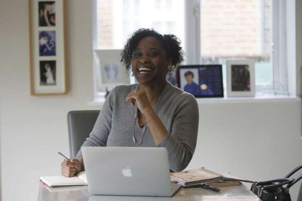 In this photo taken on Monday, Feb. 27, 2017, Spacehop user Lavinia Osbourne poses for a picture in one of the homes available for hire as office space on the Spacehop website, in London. The rise of self-employment and soaring office costs are fueling demand for shared office space in metropolitan areas, with a handful of firms renting workspace by the hour, similar to the way Airbnb offers overnight stays. Vrumi, founded in 2015, says it has 5,000 registered users and 120,000 square feet of rentable workspace across the U.K. London-based Spacehop joined the market last year, as did Breather, a four-year-old company that also operates in the U.S. and Canada.