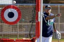 Seattle Mariners starting pitcher Felix Hernandez participates in a drill during spring training baseball practice, Wednesday, Feb. 15, 2017, in Peoria, Ariz. (AP Photo/Charlie Riedel)