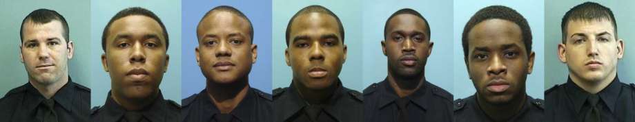 These undated photos provided by the Baltimore Police Department show, from left, Daniel Hersl, Evodio Hendrix, Jemell Rayam, Marcus Taylor, Maurice Ward, Momodu Gando and Wayne Jenkins, the seven police officers who are facing charges of robbery, extortion and overtime fraud, and are accused of stealing money and drugs from victims, some of whom had not committed crimes. (Baltimore Police Department via AP) Photo: Uncredited, AP / Public Domain