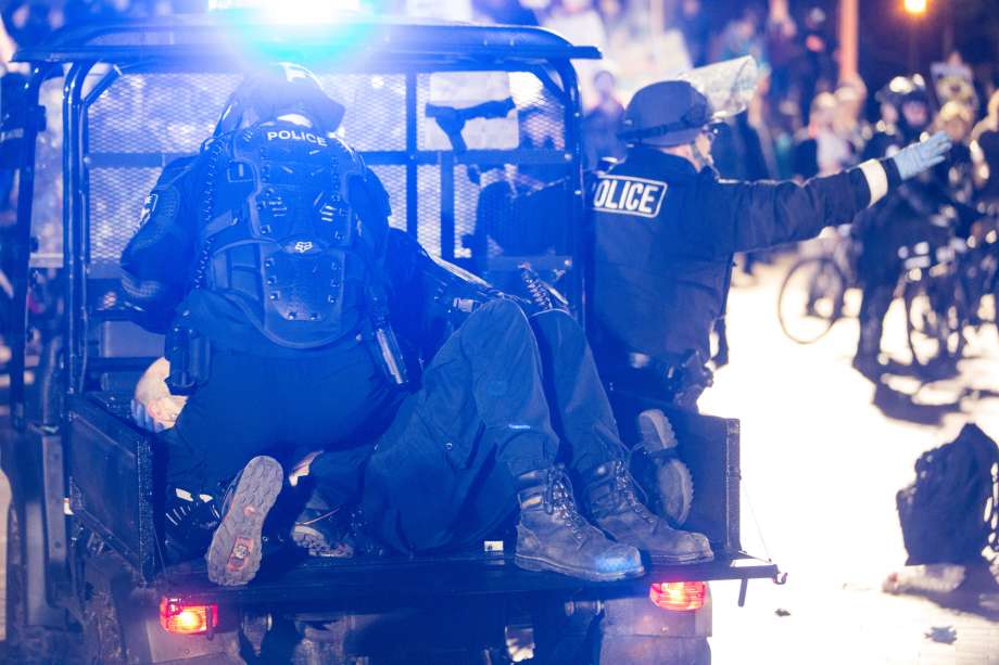 Police tend to a protester who was shot during a confrontation with hopeful attendees of controversial Breitbart.com editor Milo Yiannopoulos' speech at University of Washington on Friday, Jan. 20, 2016 Photo: GRANT HINDSLEY, SEATTLEPI.COM / SEATTLEPI.COM