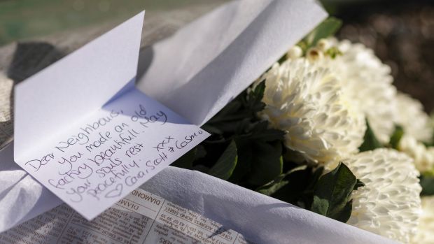 Tributes placed at the scene of the fire.