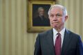 Jeff Sessions, US attorney-general, pauses after being sworn in by Vice President Mike Pence in the Oval Office on ...