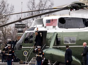 Former U.S. President Barack Obama waves to the crowd prior to departing from the East side of the U.S. Capitol during the departure ceremony at the 58th Presidential Inauguration in Washington, D.C., Jan. 20, 2017.