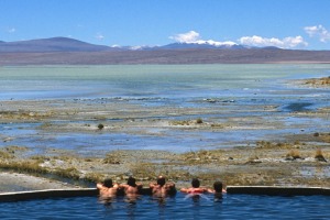 Tourists relax in the thermal pools in the Bolivian Altiplano.