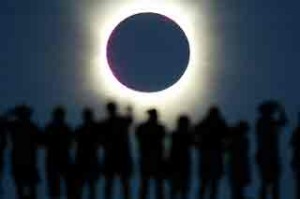 Tourists watch the sun being blocked by the moon during a solar eclipse in the Australian outback town of Lyndhurst in 2002.