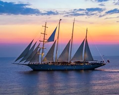 Sailing ship at night off the coast  of Croatia