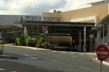 Generic TV still of signage and main building of Ipswich hospital, west of Brisbane.