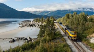 The Alaska Train travelling along the shores of Turnagain Arm near Girdwood. 