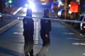 Police officers at a cordon during the investigation of a suspect car in the centre of Brussels.