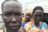 Three women in South Sudan, with tribal scarring on their faces.