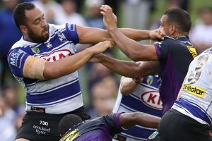 Stink: Sam Kasiano and Will Chambers grapple at Belmore Sports Ground.