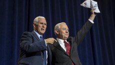 Mike Pence, 2016 Republican vice presidential nominee, left, and Senator Jeff Sessions, a Republican from Alabama, gesture during a campaign event for Donald Trump. Photographer: David Paul Morris/Bloomberg