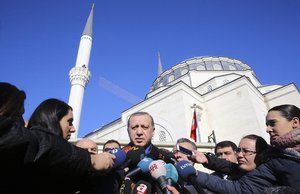 Turkey's President Recep Tayyip Erdogan speaks to reporters after Friday prayers in Istanbul, Turkey, Friday, Jan. 13, 2017.