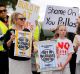 MELBOURNE, AUSTRALIA - FEBRUARY 13: ? Local Werribee residents arrive at ?Station st for tonights public meeting against ...