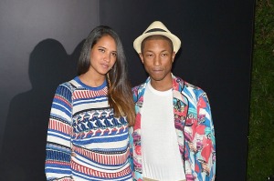 WEST HOLLYWOOD, CA - SEPTEMBER 22:  Helen Lasichanh and Pharrell Williams, both wearing Chanel, attend the Chanel dinner ...