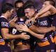 Captain courageous: New skipper Darius Boyd (centre) inspired the Broncos to a gritty win against Cronulla. 