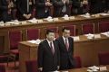 Xi Jinping, China's president, left, and Li Keqiang, China's premier, arrive during the opening of the fifth session of ...